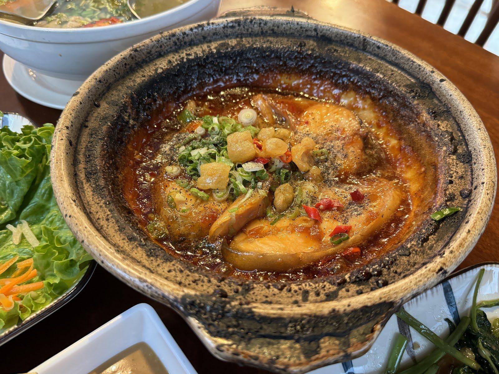 Caramelized fish in a clay pot